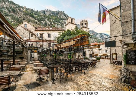 Kotor, Montenegro - September 17 2018: An Outdoor Sidewalk Cafe Sits Empty Early In The Morning Near