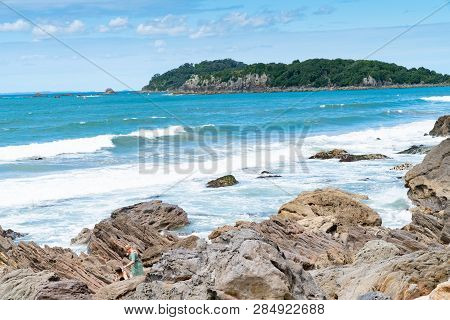 Mount Maunganui New Zealand - February 8 2019: Rocky Edge Of Lower Mount Maunganui With People Clamb