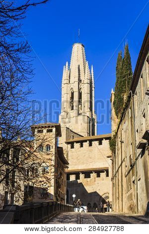 Girona, Spain - Dec 2018: Bell Tower Of Collegiate Church Of St. Felix From Pujada De Sant Feliu Str