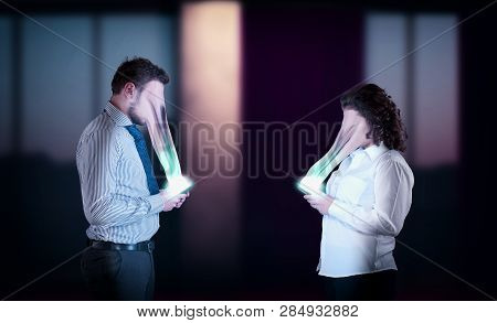 Couple Using Smartphone . The Concept Of Phone Addiction. Face Absorbed By The Phone.
