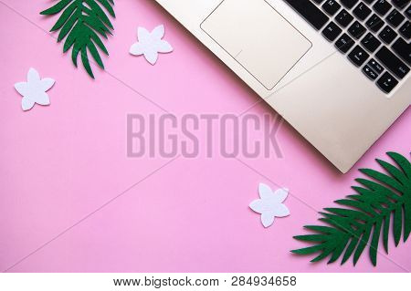 Workspace In A Pink Trendy Color Or Summer Design With A Concept To Start A Vacation. Laptop And Nex
