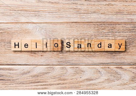 Hello Sunday Word Written On Wood Block. Hello Sunday Text On Wooden Table For Your Desing, Concept