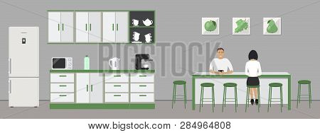Green Office Kitchen. Dining Room In The Office. Employees Are Sitting At The Table. Coffee Break. T