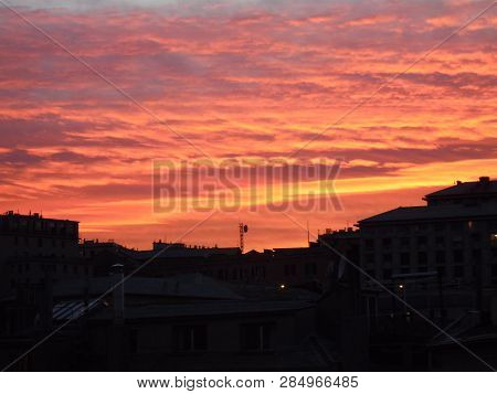 Genova, Italy - 02/12/2019: An Amazing Caption Of The Sunset Over The City Of Genoa In Winter Days C