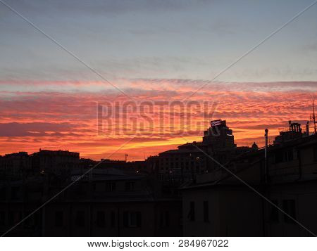 Genova, Italy - 02/12/2019: An Amazing Caption Of The Sunset Over The City Of Genoa In Winter Days C