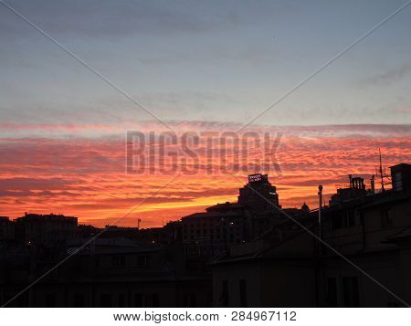 Genova, Italy - 02/12/2019: An Amazing Caption Of The Sunset Over The City Of Genoa In Winter Days C