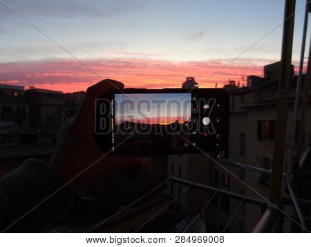 Genova, Italy - 02/12/2019: An Amazing Caption Of The Sunset Over The City Of Genoa In Winter Days C
