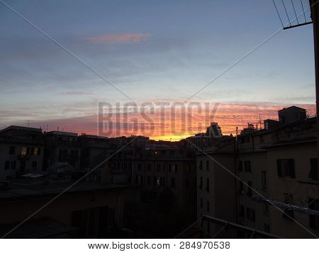 Genova, Italy - 02/12/2019: An Amazing Caption Of The Sunset Over The City Of Genoa In Winter Days C