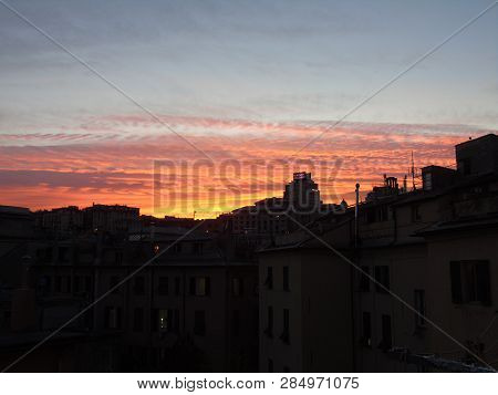 Genova, Italy - 02/12/2019: An Amazing Caption Of The Sunset Over The City Of Genoa In Winter Days C