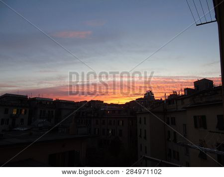 Genova, Italy - 02/12/2019: An Amazing Caption Of The Sunset Over The City Of Genoa In Winter Days C