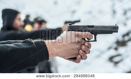Close-up View Of Shooter Practice Handgun Shooting In Row Group