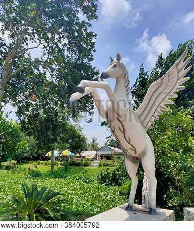 08 Aug 2020 Tangail, Bangladesh: White Statue Of A Riding Winged Horse (pegasus) Near Sp Park, Tanga