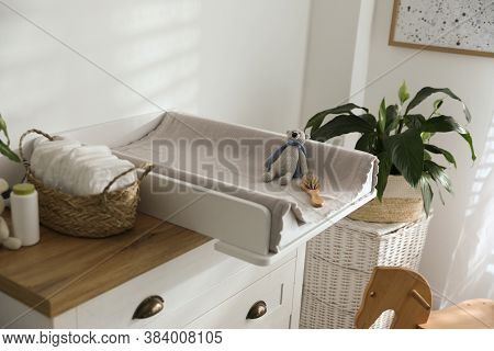 Chest Of Drawers With Changing Pad And Tray In Nursery. Baby Room Interior Design