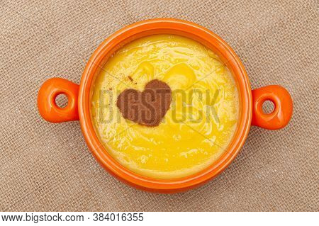 Homemade Sweet Corn Pudding Known In Brazil As Curau Or Canjica Nordestina In Ceramic Bowl. Powdered