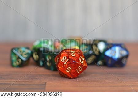 Colorful Red, Green And Bue Role Playing Dice On Table With Blurry Background