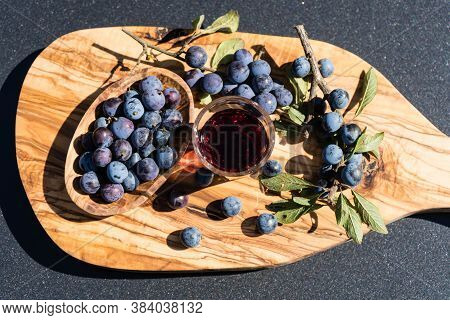 Blue Round Fruits Of The Blackthorn Bush