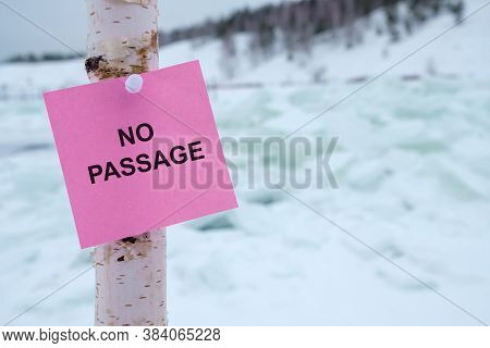 No Passage Is Written On A Red Sign Near The Frozen Reservoir. Danger Zone In Winter