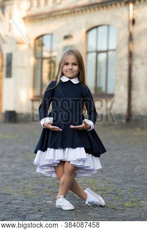 Plie Style Stance. Little Ballerina Wear School Uniform. Small Ballet Dancer Outdoors. Ballet School