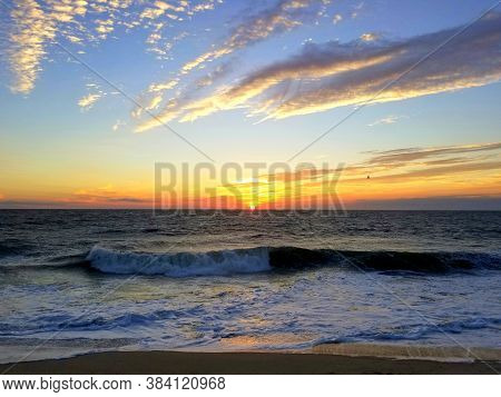 Beautiful Sunrise Overlooking The Waves Near Dewey Beach, Delaware, U.s.a