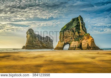 The Archway Islands Are A Group Of Rock Stacks Off Wharariki Beach On New Zealand's South Island Nea