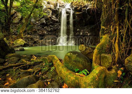 Tropical Landscape. Beautiful Hidden Waterfall In Rainforest. Adventure And Travel Concept. Nature B