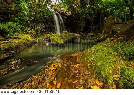 Tropical Landscape. Beautiful Hidden Waterfall In Rainforest. Adventure And Travel Concept. Nature B