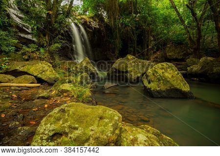 Tropical Landscape. Beautiful Hidden Waterfall In Rainforest. Adventure And Travel Concept. Nature B