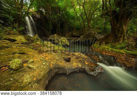 Tropical Landscape. Beautiful Hidden Waterfall In Rainforest. Adventure And Travel Concept. Nature B