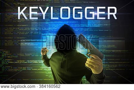 Faceless hacker with KEYLOGGER inscription on a binary code background