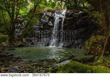 Tropical Landscape. Beautiful Hidden Waterfall In Rainforest. Adventure And Travel Concept. Nature B