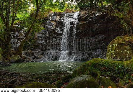 Tropical Landscape. Beautiful Hidden Waterfall In Rainforest. Adventure And Travel Concept. Nature B