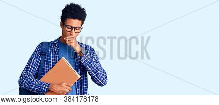 Young african american man wearing student backpack holding book feeling unwell and coughing as symptom for cold or bronchitis. health care concept. 