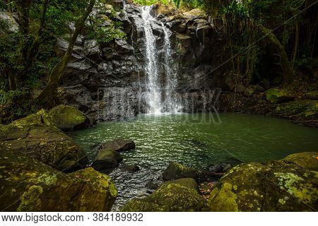 Tropical Landscape. Beautiful Hidden Waterfall In Rainforest. Adventure And Travel Concept. Nature B