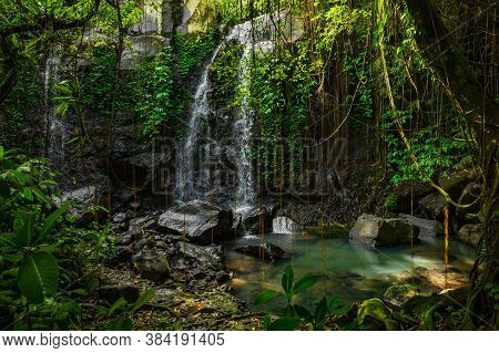Tropical Landscape. Beautiful Hidden Waterfall In Rainforest. Adventure And Travel Concept. Nature B