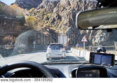 Tbilisi, Georgia - October 25, 2019: Car Vindow, Hand Of Woman On Steering Wheel And View To The Roa