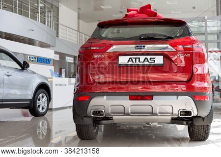 Russia, Izhevsk - August 14, 2020: New Modern Atlas And Other Cars In The Geely Showroom.