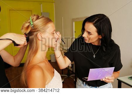 Hairdresser And Visagiste Working At The Beauty Studio Salon With Model