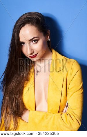 The Girl In The Yellow Coat Is Posing