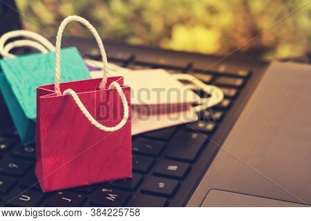 Business Concept Online Shopping, Paper Shopping Bags On Notebook Keyboard. Online Shopping E-commer