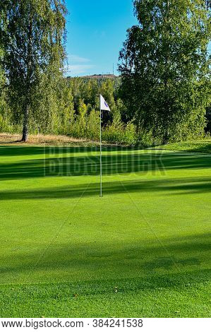 Shadows Over A Golf Green In Sweden
