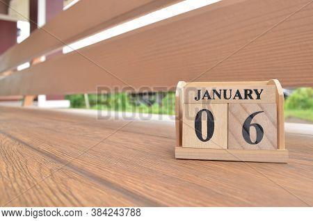 January 6, Number Cube With Wooden Balcony Background.