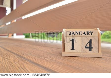 January 14, Number Cube With Wooden Balcony Background.