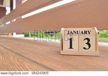 January 13, Number Cube With Wooden Balcony Background.