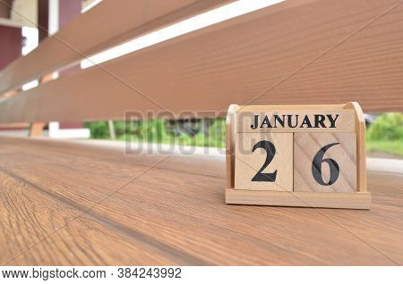 January 26, Number Cube With Wooden Balcony Background.
