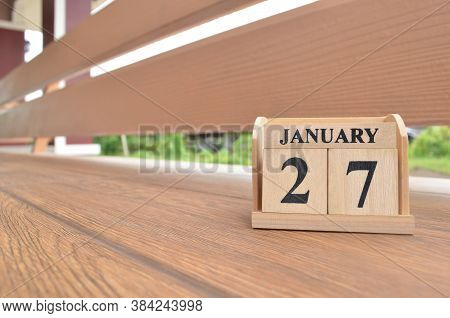 January 27, Number Cube With Wooden Balcony Background.