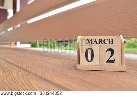 March 2, Number Cube With Wooden Balcony Background.