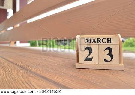 March 23, Number Cube With Wooden Balcony Background.