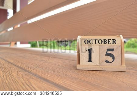October 15, Number Cube With Wooden Balcony Background.