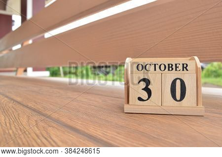 October 30, Number Cube With Wooden Balcony Background.