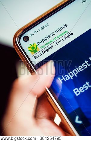 Kolkata, West Bengal, India, September 7, 2020 : Happiest Minds Ipo Background. Hand Holding Mobile 